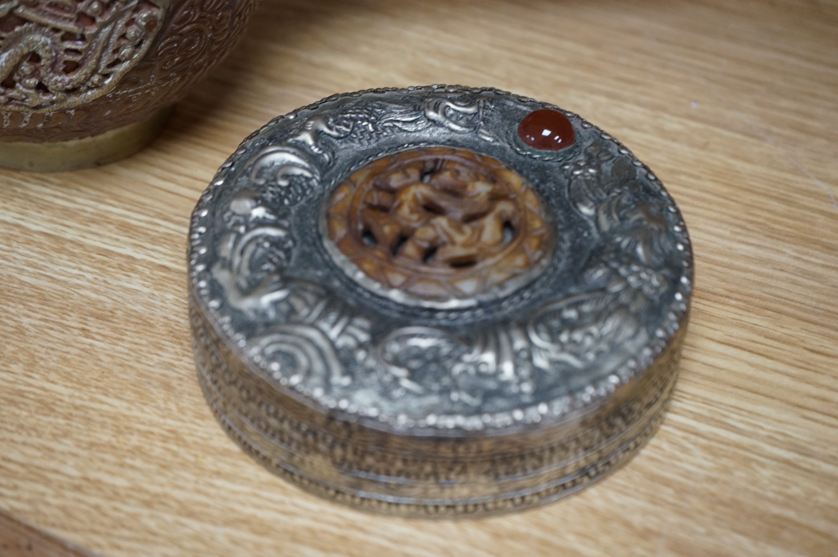 A Tibetan copper and brass pot and a similar box and cover with mirrored interior, largest 19cm high (2). Condition - poor to fair